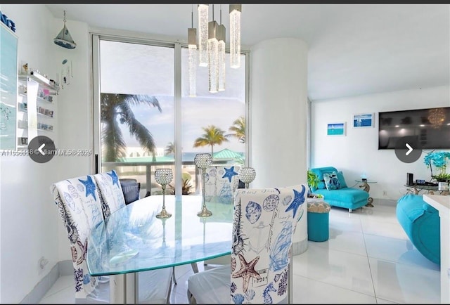 dining space with a wealth of natural light and light tile patterned floors