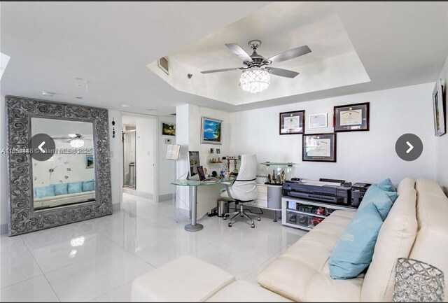 kitchen featuring light tile patterned flooring, stainless steel appliances, tasteful backsplash, and white cabinetry