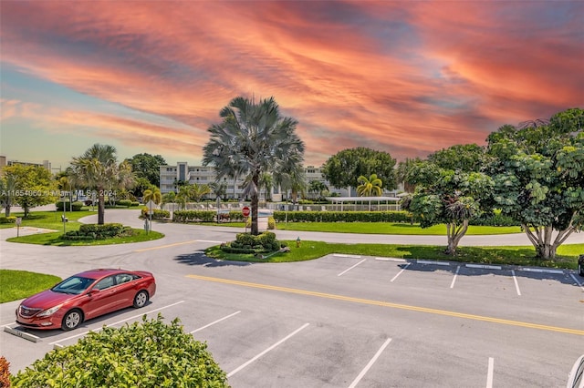 view of parking at dusk