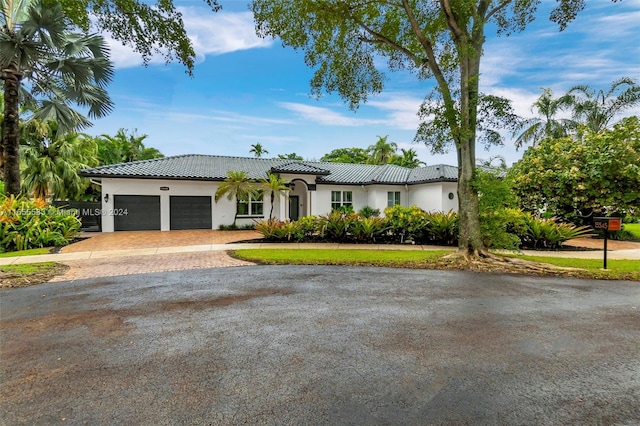 mediterranean / spanish-style house featuring a garage