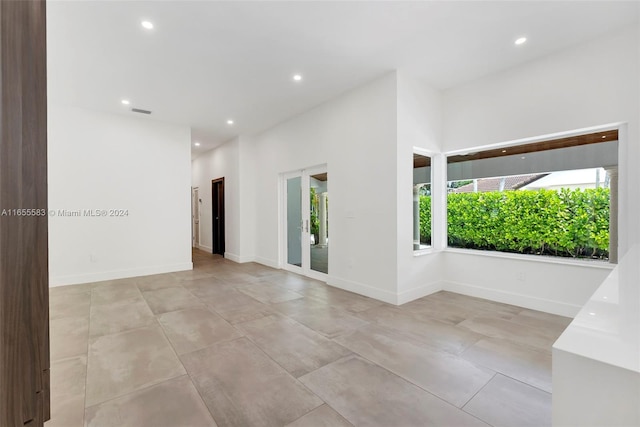 spare room with plenty of natural light