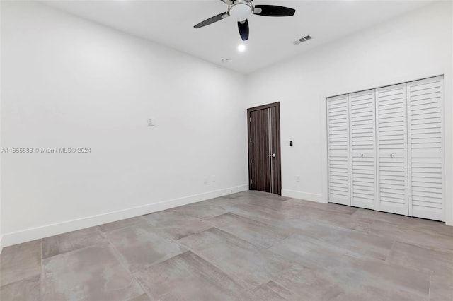 unfurnished bedroom featuring ceiling fan