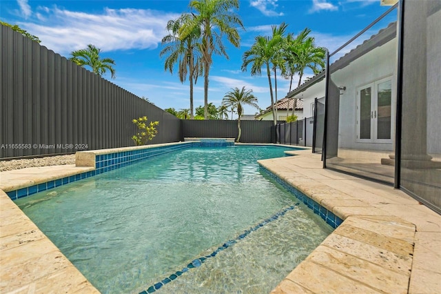 view of swimming pool with a patio area