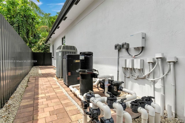 view of side of home featuring central air condition unit