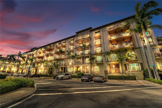 view of outdoor building at dusk