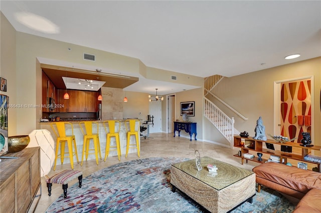 living room with an inviting chandelier