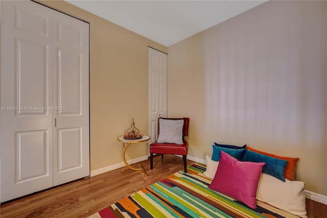 bedroom featuring hardwood / wood-style flooring and a closet