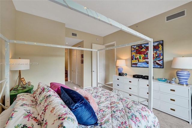 bedroom with light colored carpet