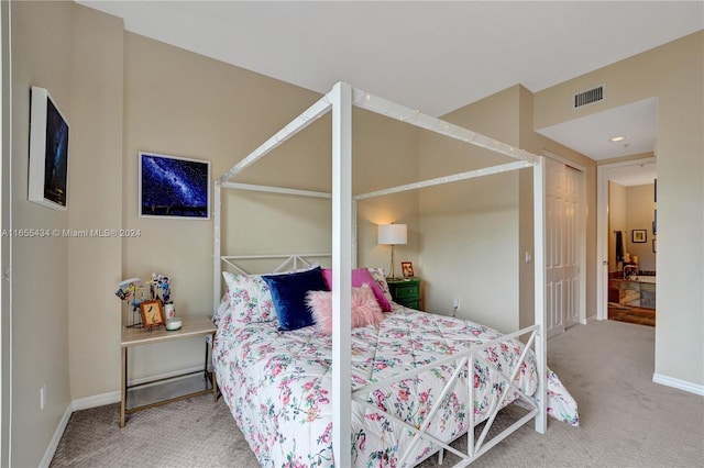 bedroom with carpet floors and a closet