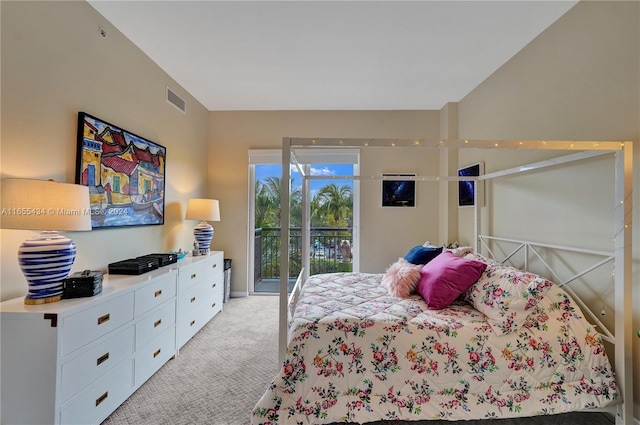 carpeted bedroom with access to exterior