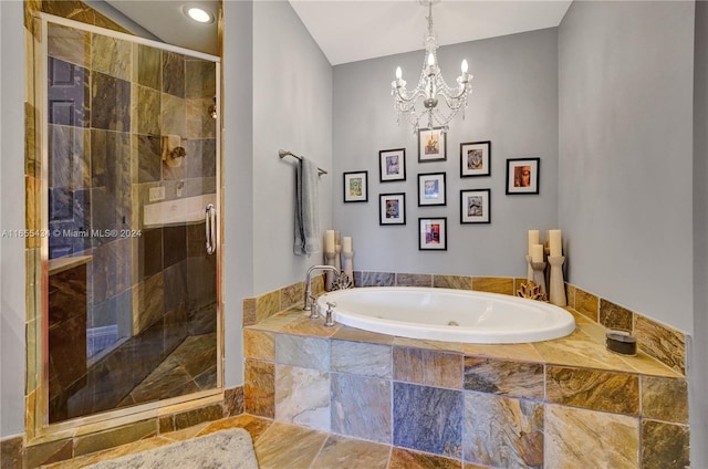 bathroom with separate shower and tub and a chandelier