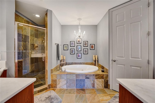 bathroom featuring vanity, plus walk in shower, and a notable chandelier