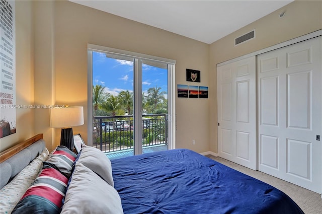 carpeted bedroom featuring access to outside and a closet