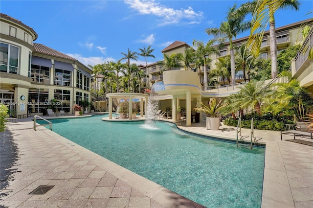 view of pool with pool water feature and a patio area