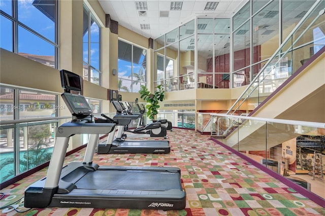 gym with a towering ceiling