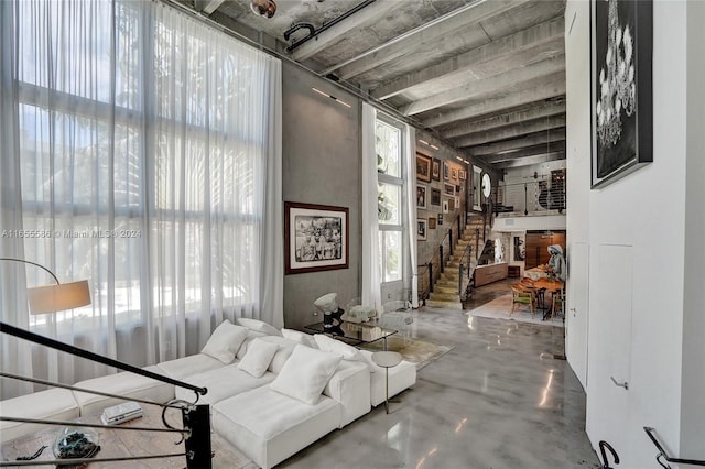 sitting room featuring concrete flooring and a fireplace