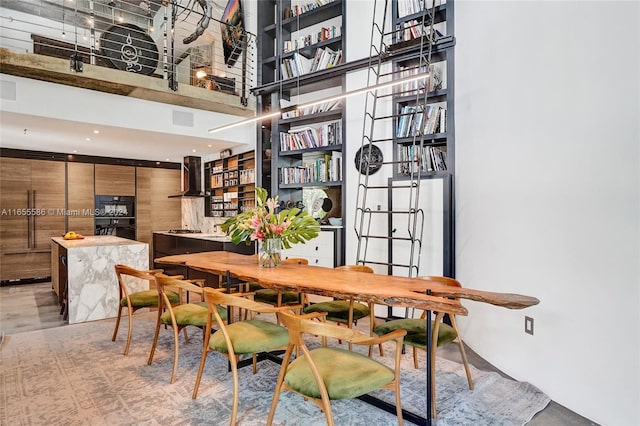 dining space with a high ceiling