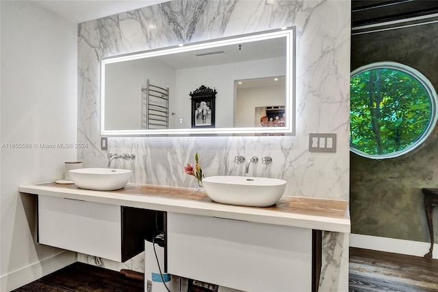 bathroom with hardwood / wood-style flooring and vanity