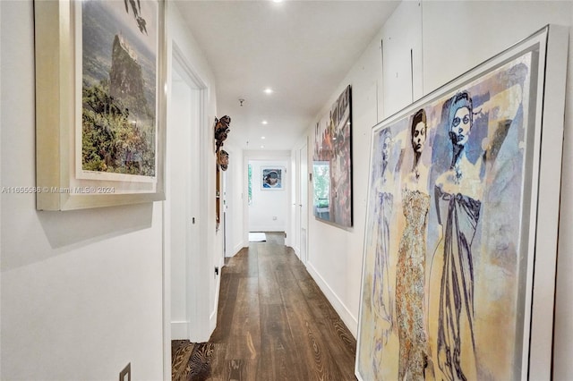 hallway with dark hardwood / wood-style flooring