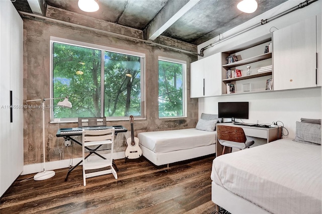 bedroom with dark hardwood / wood-style flooring