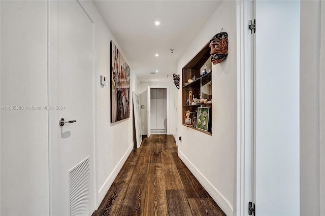 hallway featuring dark hardwood / wood-style flooring