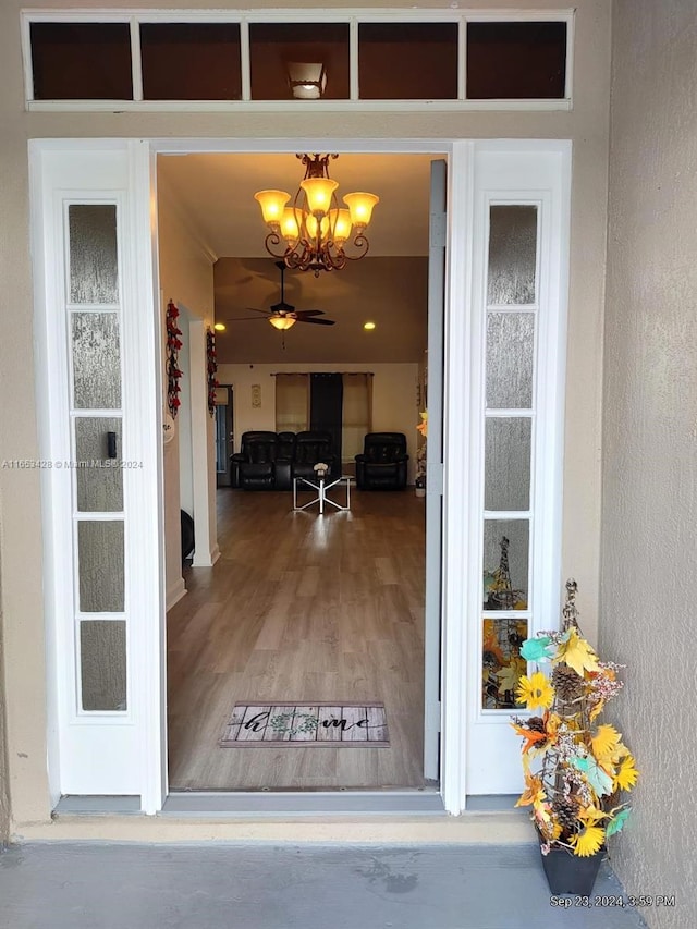 view of exterior entry featuring ceiling fan