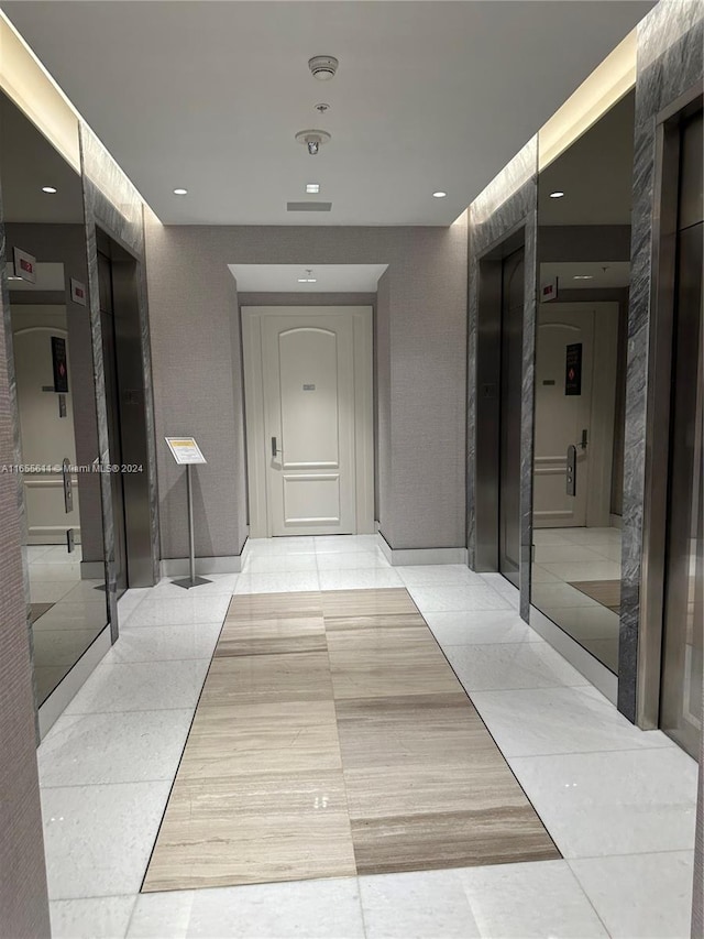 hallway featuring elevator