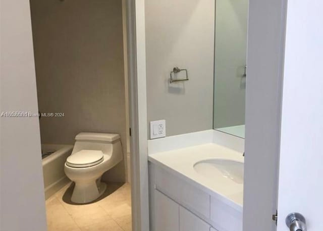 bathroom featuring vanity, toilet, and tile patterned floors