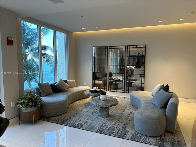 tiled living room with plenty of natural light