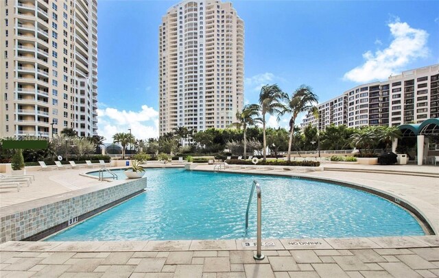 view of swimming pool featuring a patio