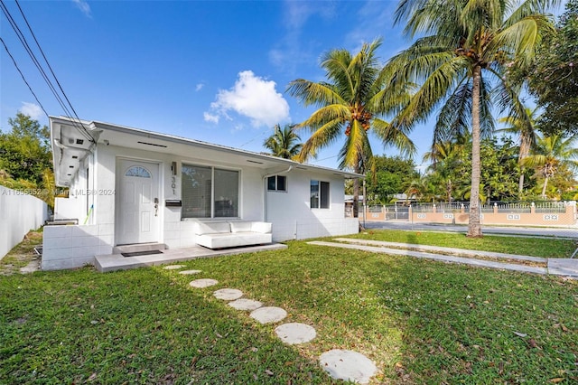 back of house with a yard