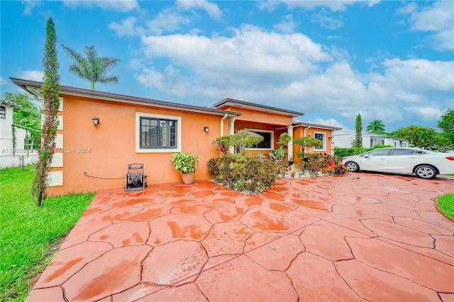 view of front of house with a patio