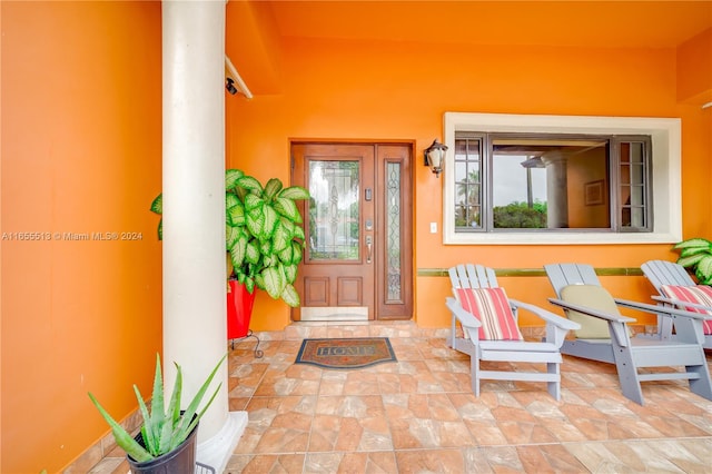 entrance to property featuring a patio area