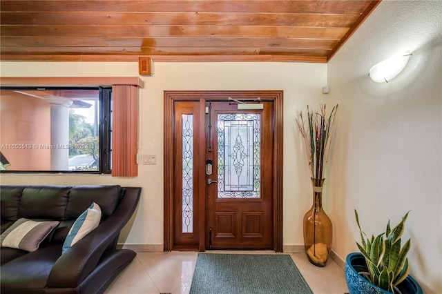 tiled foyer entrance featuring wooden ceiling