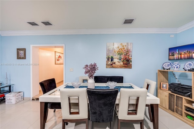 tiled dining area with crown molding