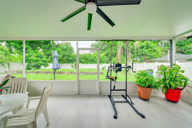 sunroom featuring ceiling fan