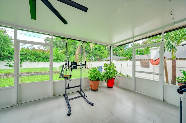 sunroom with ceiling fan and a wealth of natural light