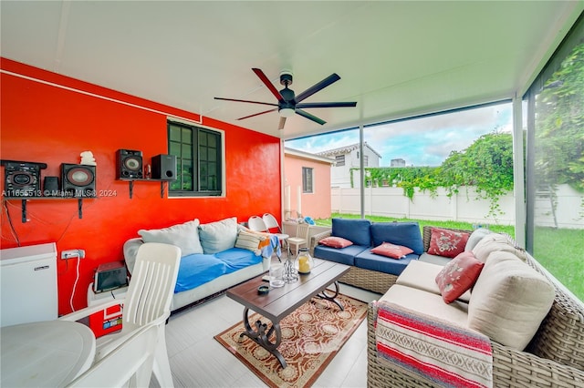 living room with a healthy amount of sunlight and ceiling fan