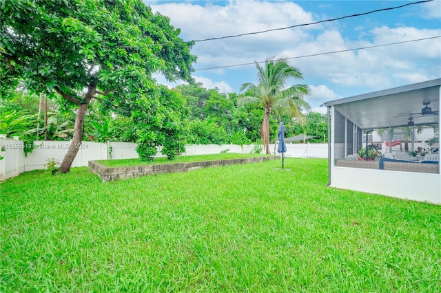 view of yard with a sunroom