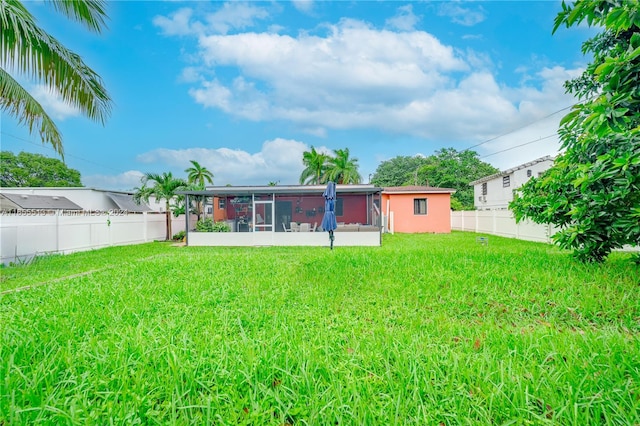 view of yard with a sunroom