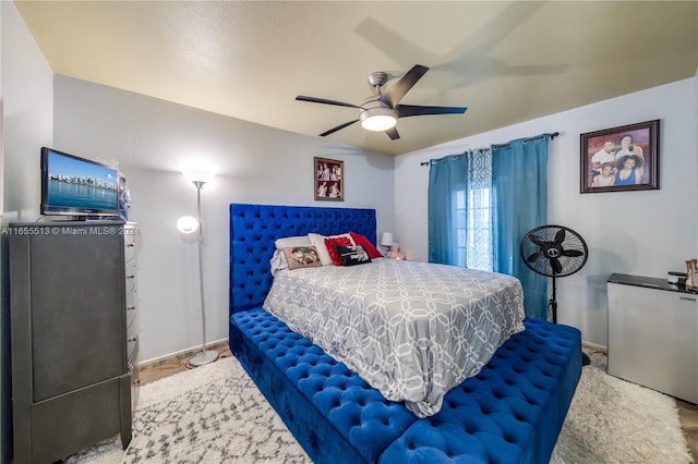 bedroom featuring ceiling fan and carpet floors