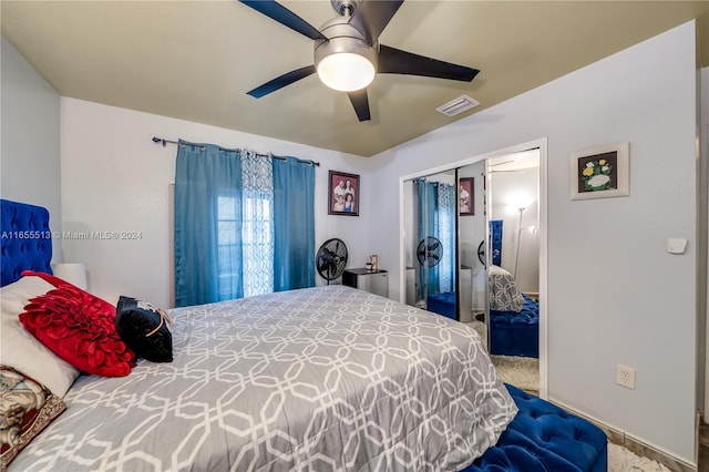 carpeted bedroom with a closet and ceiling fan