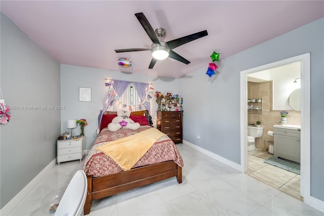 bedroom with ceiling fan and ensuite bathroom