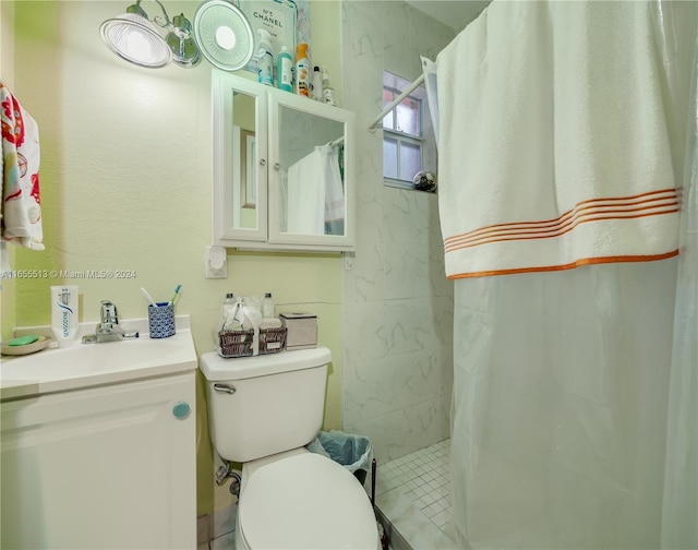 bathroom featuring a shower with curtain, toilet, and vanity