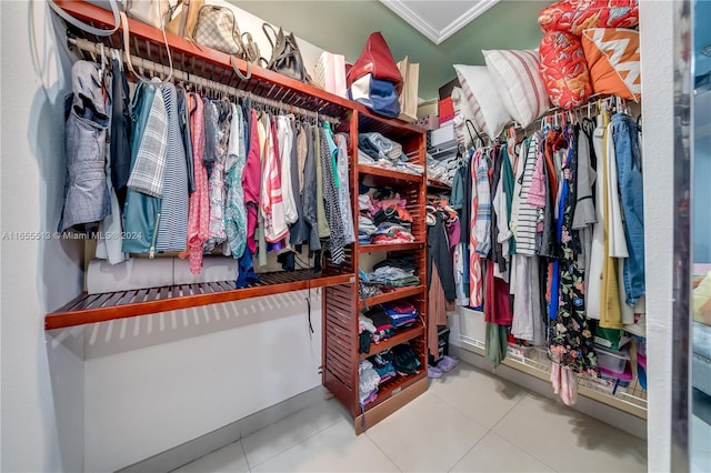 spacious closet with light tile patterned floors