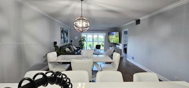 dining space with crown molding, dark wood-type flooring, and a notable chandelier