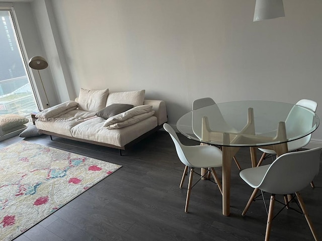 dining space featuring dark wood-type flooring