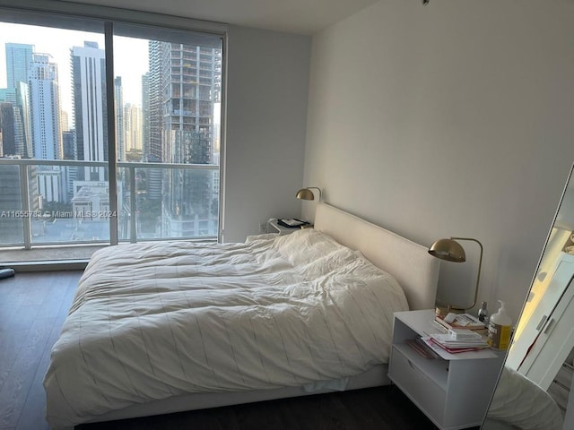 bedroom featuring dark wood-type flooring