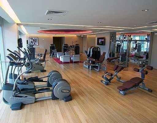 gym featuring hardwood / wood-style floors