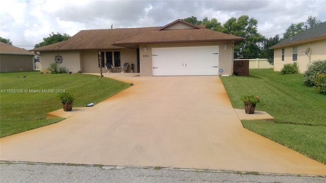 ranch-style house featuring a garage, driveway, a front lawn, and stucco siding